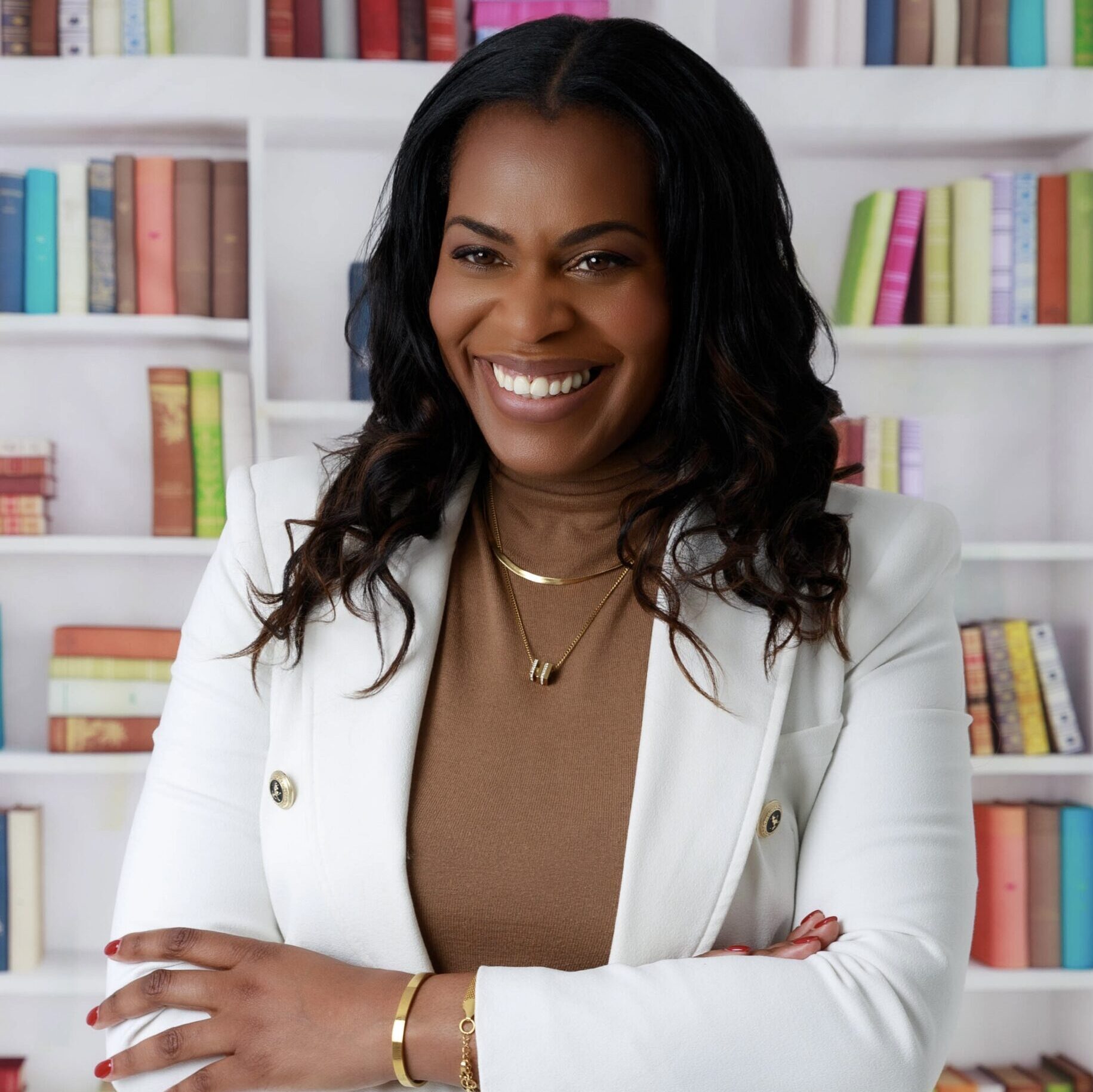 Emma Pinnock, author of Igniting Potential, photographed in front of a bookshelf